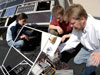 Dr. Arne Jacobson and two students test solar PV modules.